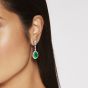 Model wearing emerald and diamond drop earrings 