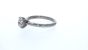 R2087 - Solitaire Round Diamond Ring with Discreet Pink Diamonds